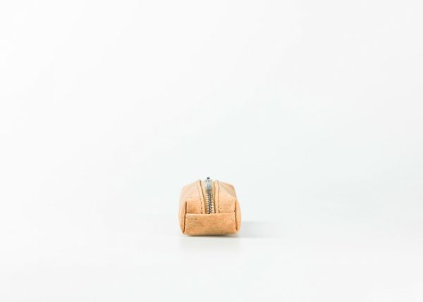 Front view on a light natural patterned cork pencilcase with a silver zip opening